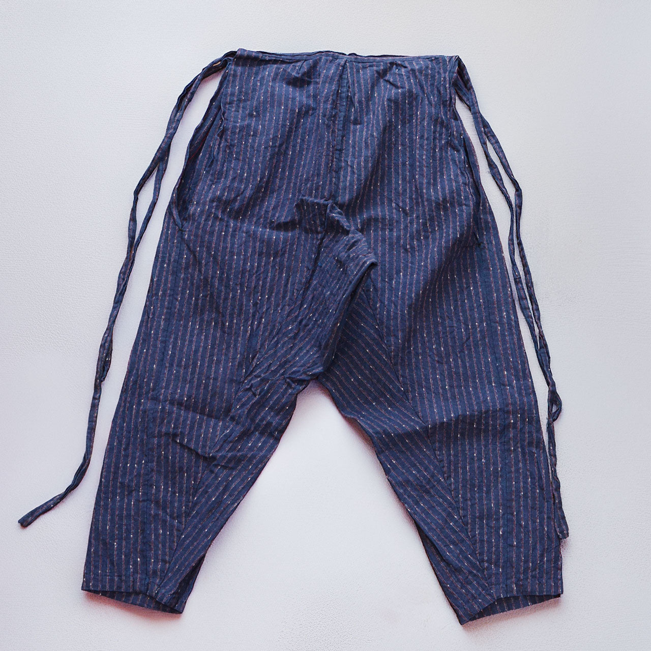 Indigo stripe cotton monpe pants, back, flat lay with tie cords, Japanese vintage workwear, estimated 1930s–1950s, NAMBA SHOUTEN