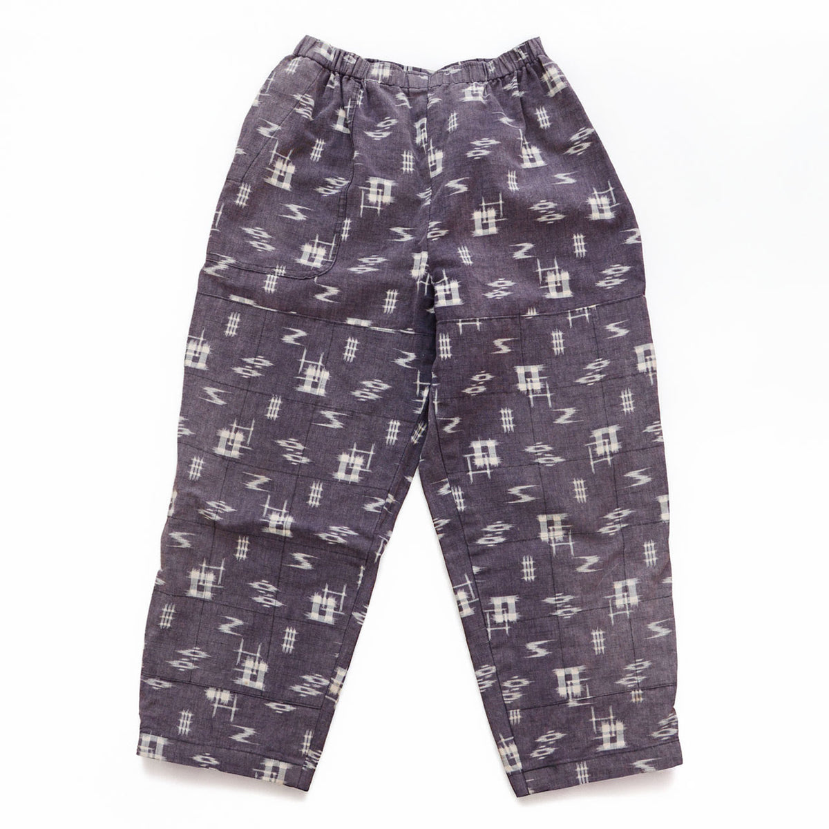 Showa-era Japanese vintage cotton kasuri monpe pants with a single front pocket and grid-stitched reinforcement panels