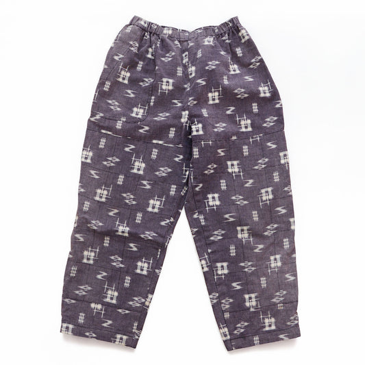 Showa-era Japanese vintage cotton kasuri monpe pants with a single front pocket and grid-stitched reinforcement panels