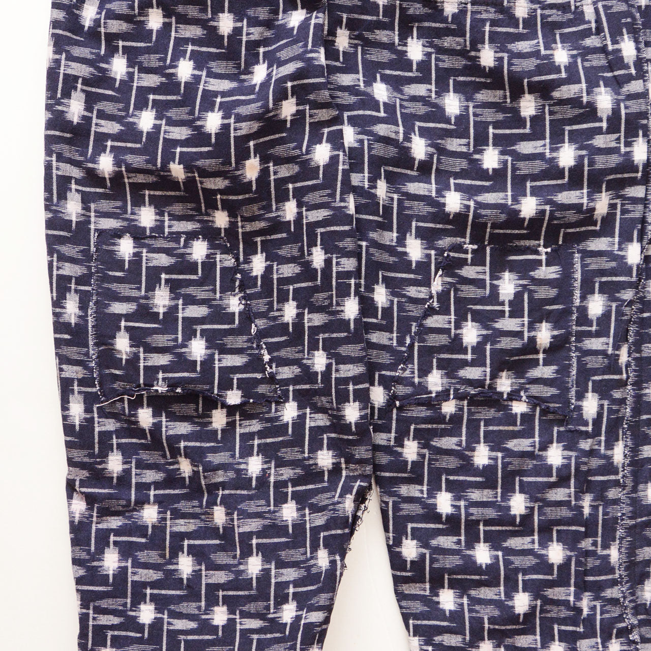 Interior reinforcement stitching of vintage kasuri monpe pants, navy cotton, hand-sewn backing detail