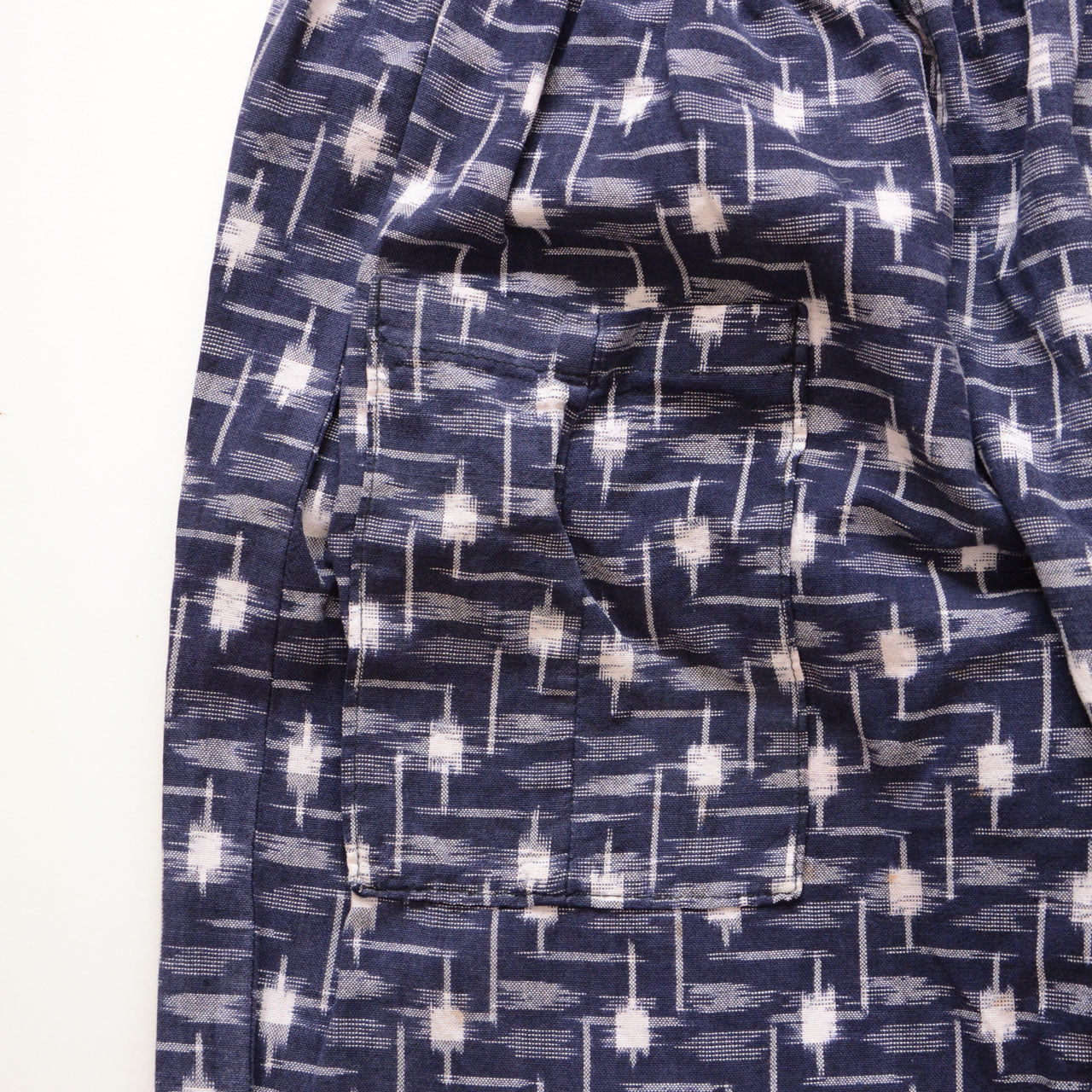 Single front pocket of vintage kasuri monpe pants, navy cotton ikat weave, one-of-a-kind Japan vintage workwear