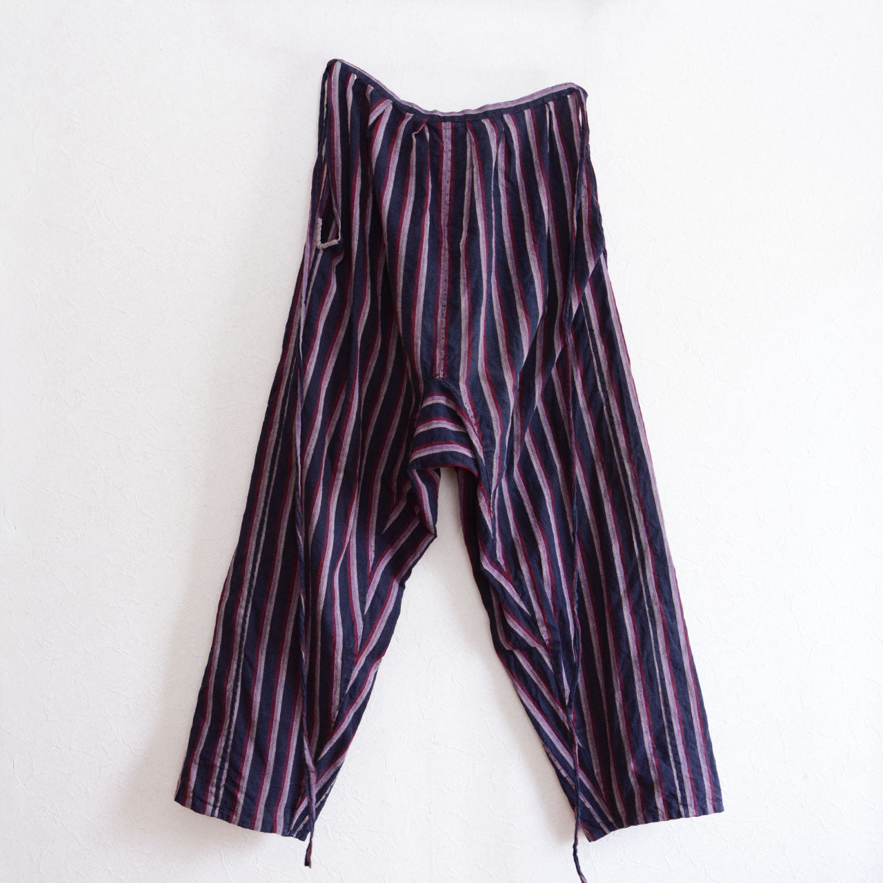 Classic Japanese mompe-style pants featuring natural cotton texture and vintage character.