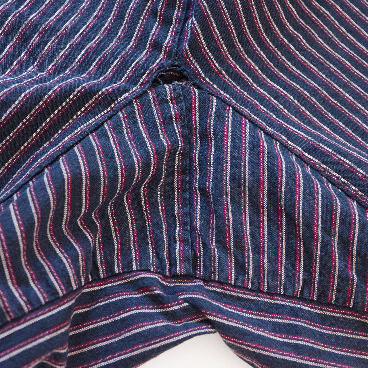 Crotch gusset of vintage Japanese monpe pants, diagonal seam construction, striped cotton