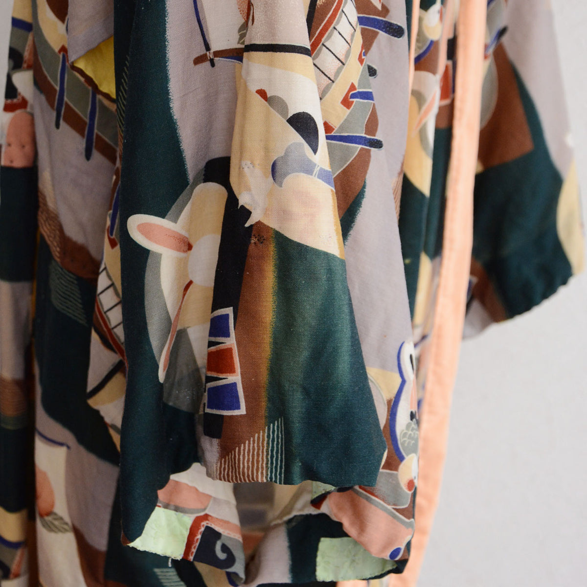 Areas of discoloration on the patterned fabric of a Japanese vintage nagajuban kimono