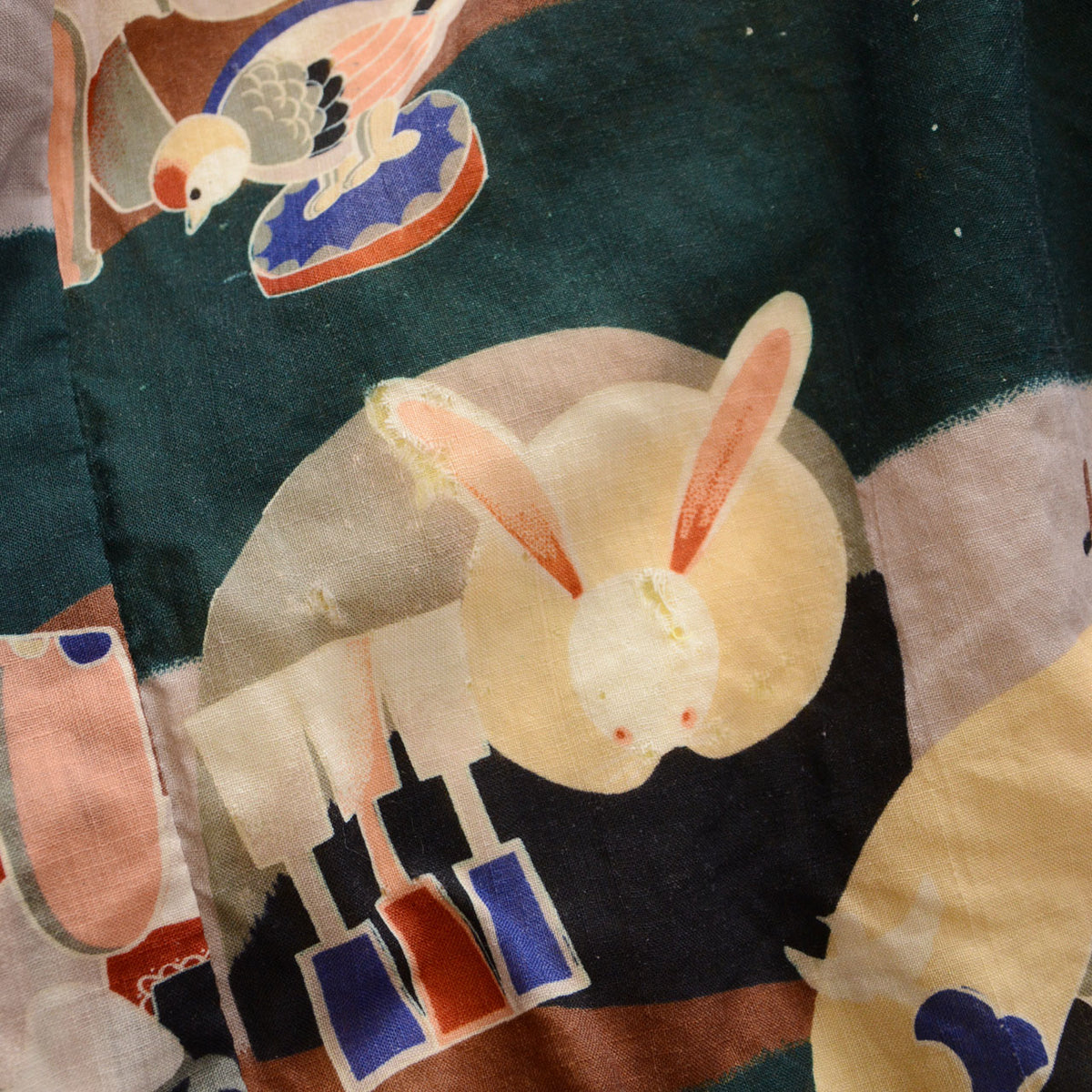 Fabric damage within the moon rabbit motif of a Japanese vintage nagajuban kimono