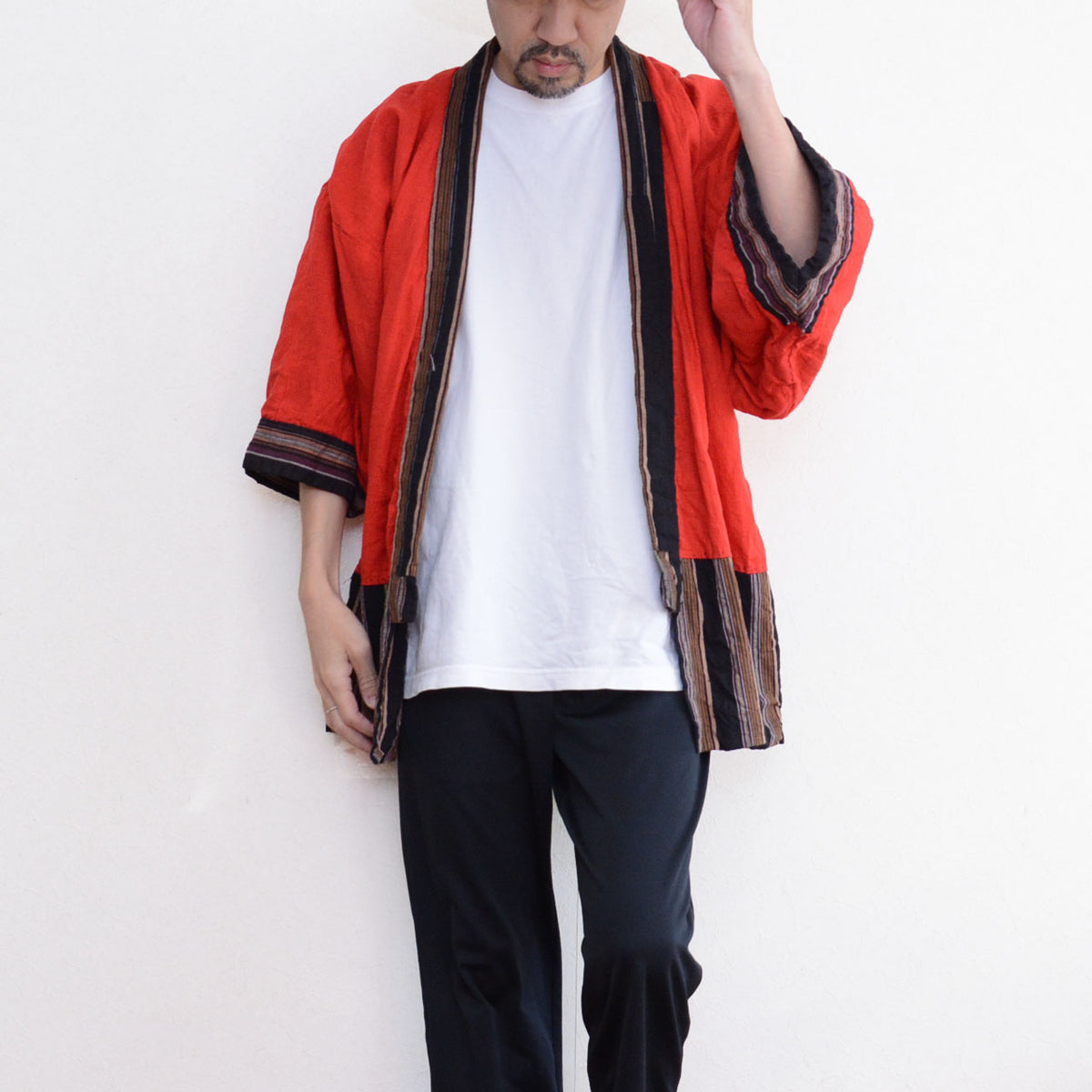 Red cotton noragi lining with striped cuffs and hem paired with black trousers