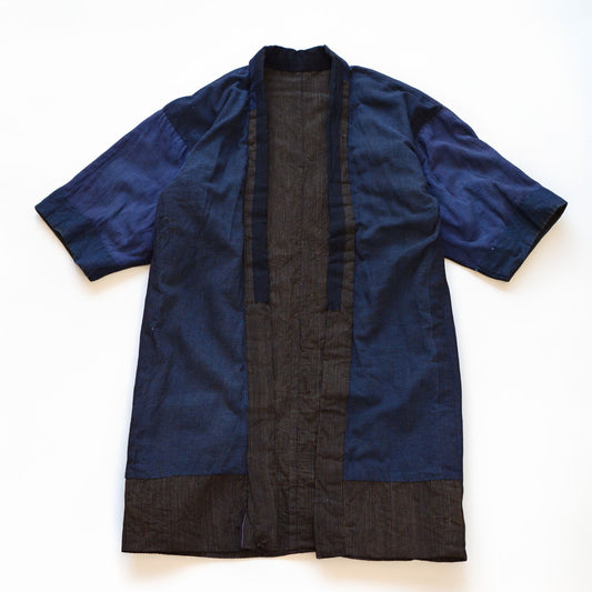 Boro noragi jacket, indigo-dyed cotton body with striped cotton hem, crazy pattern lining visible, pre-WWII Japan vintage, Tohoku