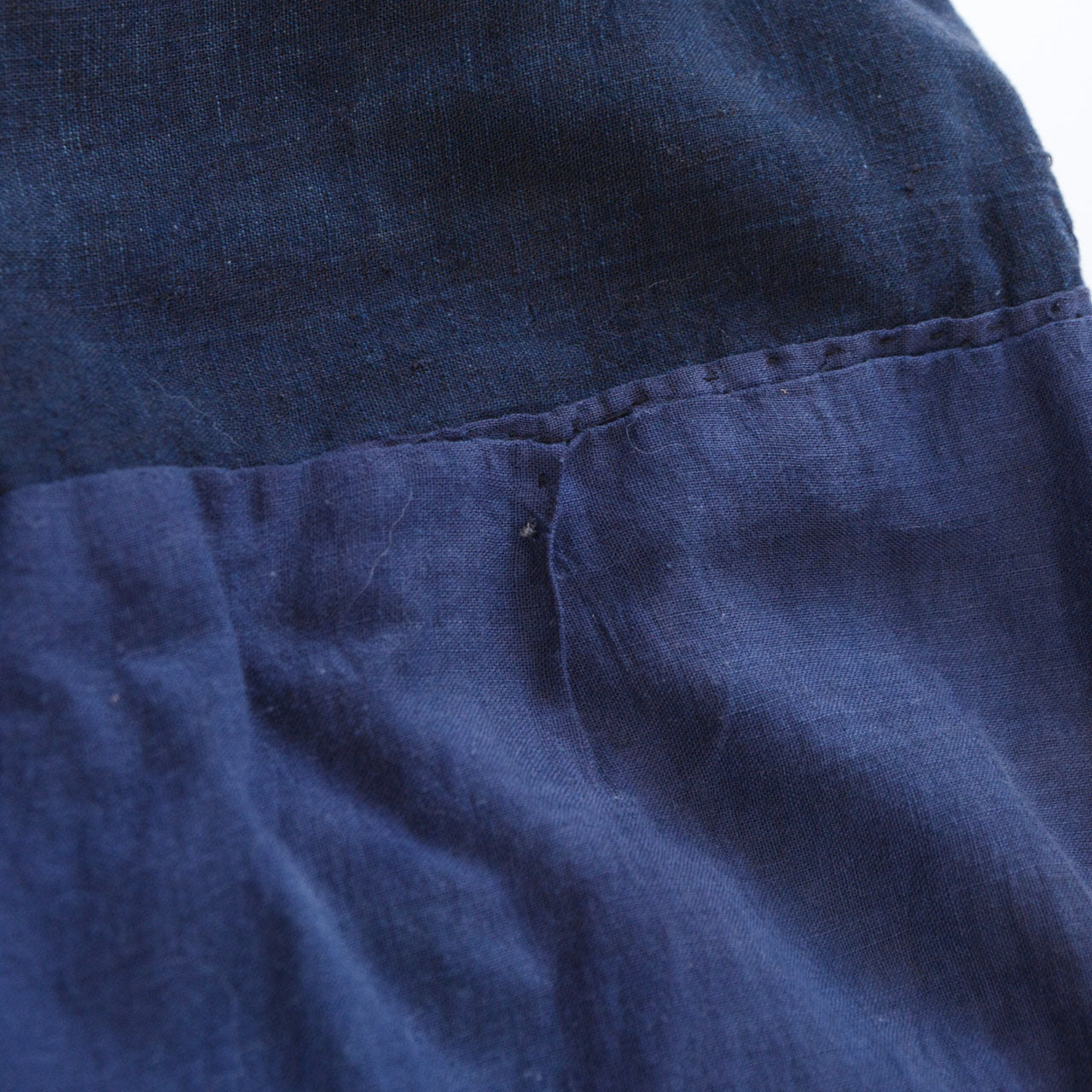 Boro noragi jacket, rough hand-stitching detail, aged cotton with visible coarse seam work, pre-WWII Japan vintage, Tohoku