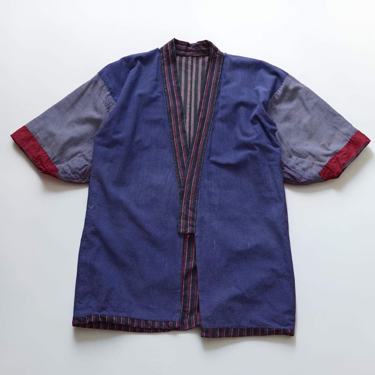Reverse side of a vintage Japanese cotton noragi with dark navy vertical stripes