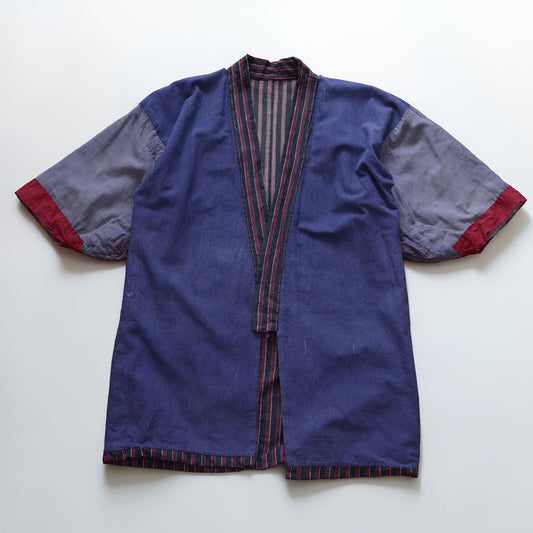 Reverse side of a vintage Japanese cotton noragi with dark navy vertical stripes