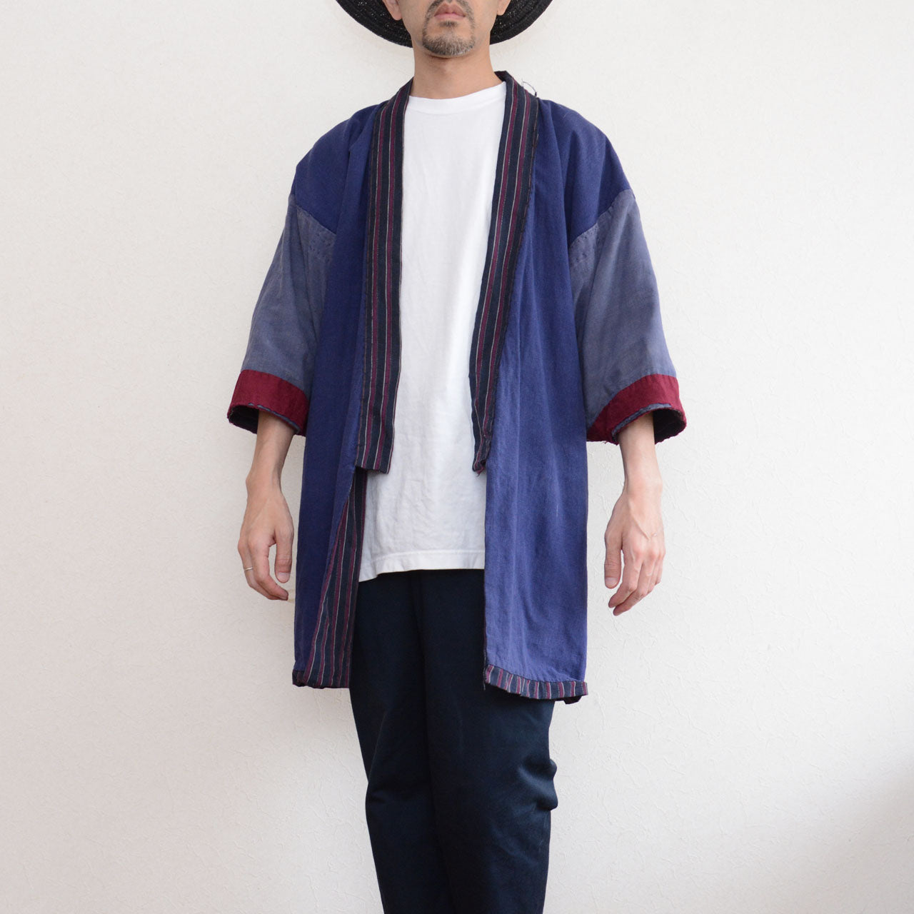 Model wearing a vintage Japanese noragi, showing the front opening, contrasting sleeves, and red sleeve ends