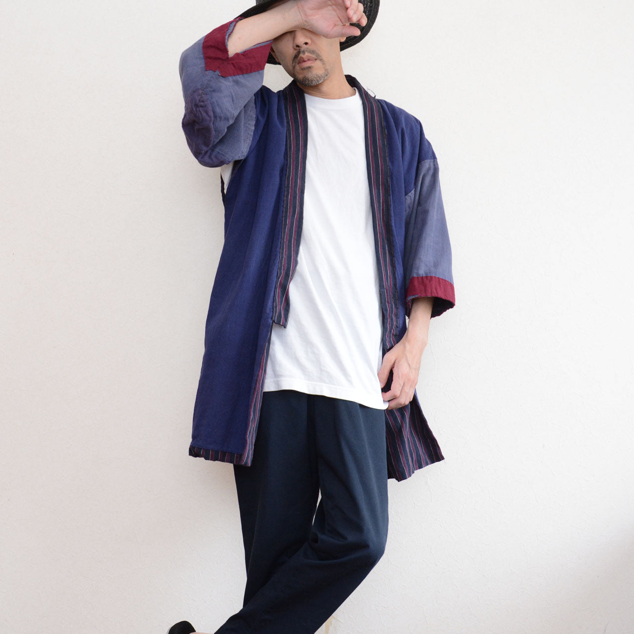 Front view of a model wearing a vintage Japanese noragi with striped trim and contrasting sleeves