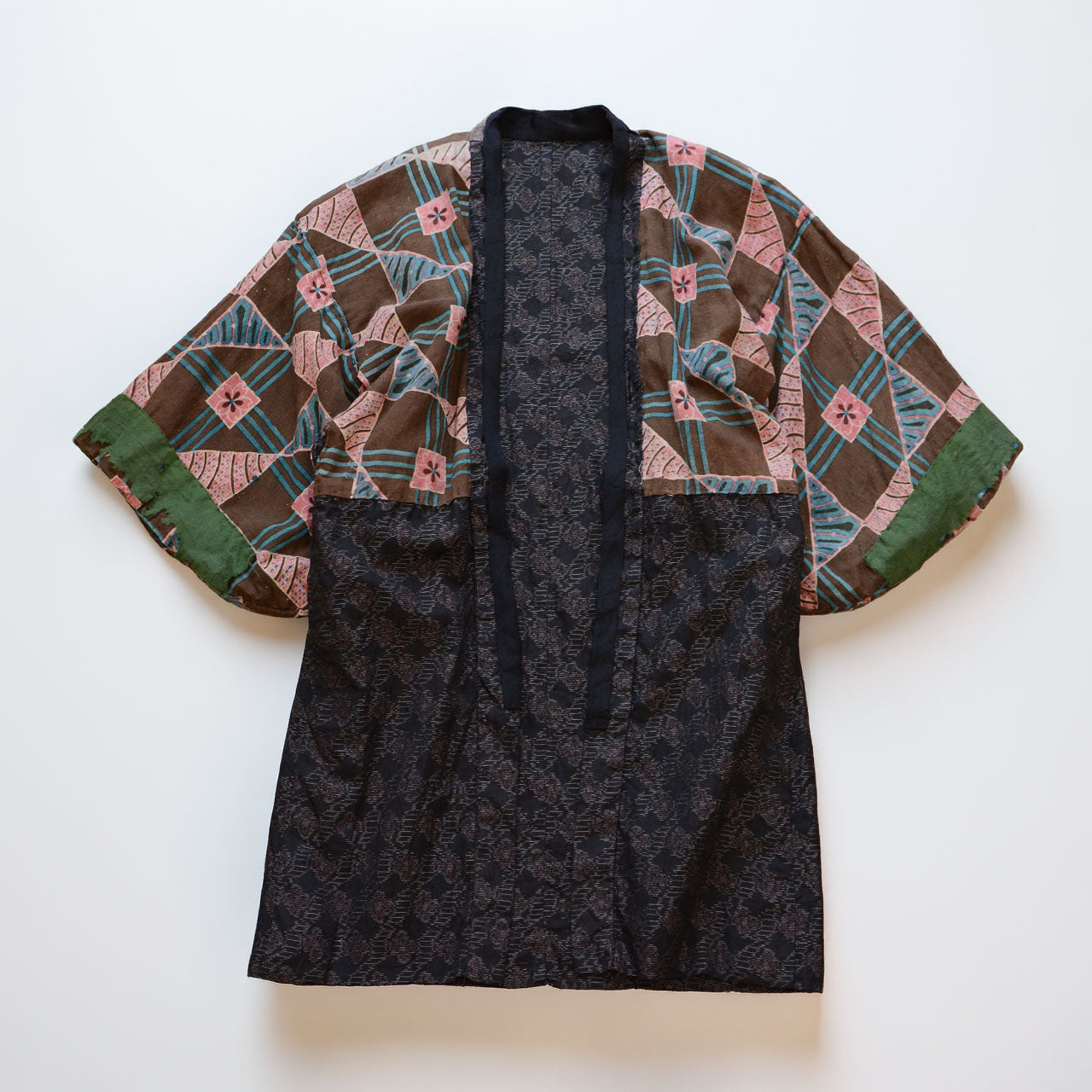 Vintage Japanese noragi jacket, reverse side, floral cotton lining, laid flat, full front view, Showa era