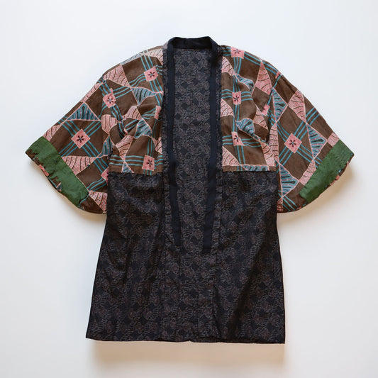 Vintage Japanese noragi jacket, reverse side, floral cotton lining, laid flat, full front view, Showa era