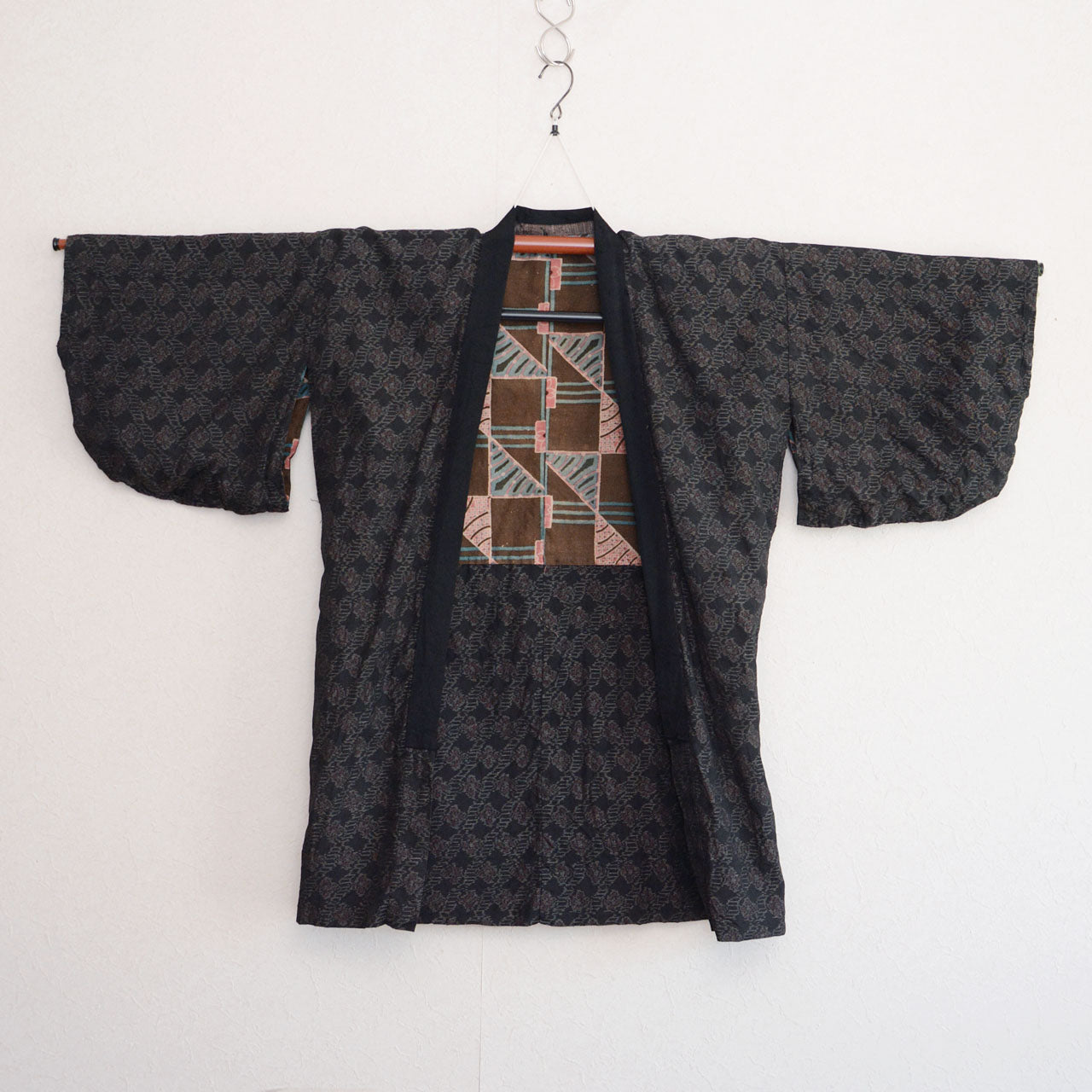 Vintage Japanese noragi jacket, outer fabric, floral mixed-weave, front view, displayed on kimono hanger, Showa era