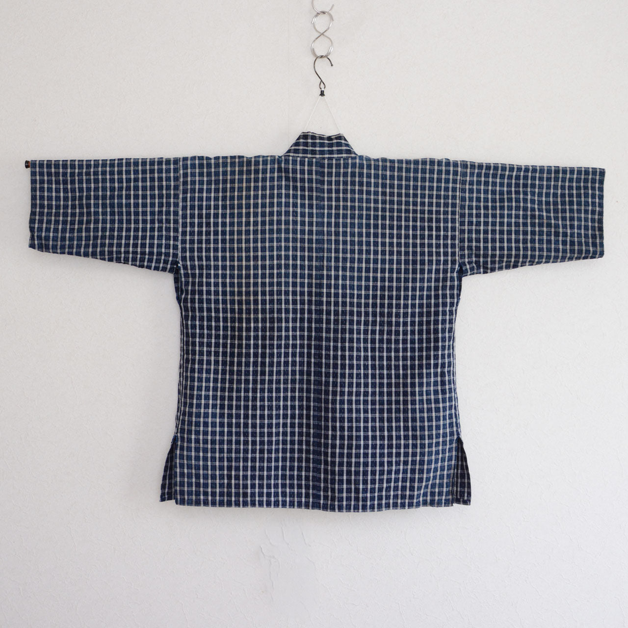 Vintage noragi jacket on hanger, back view — indigo-dyed cotton check, early Showa era Japan vintage
