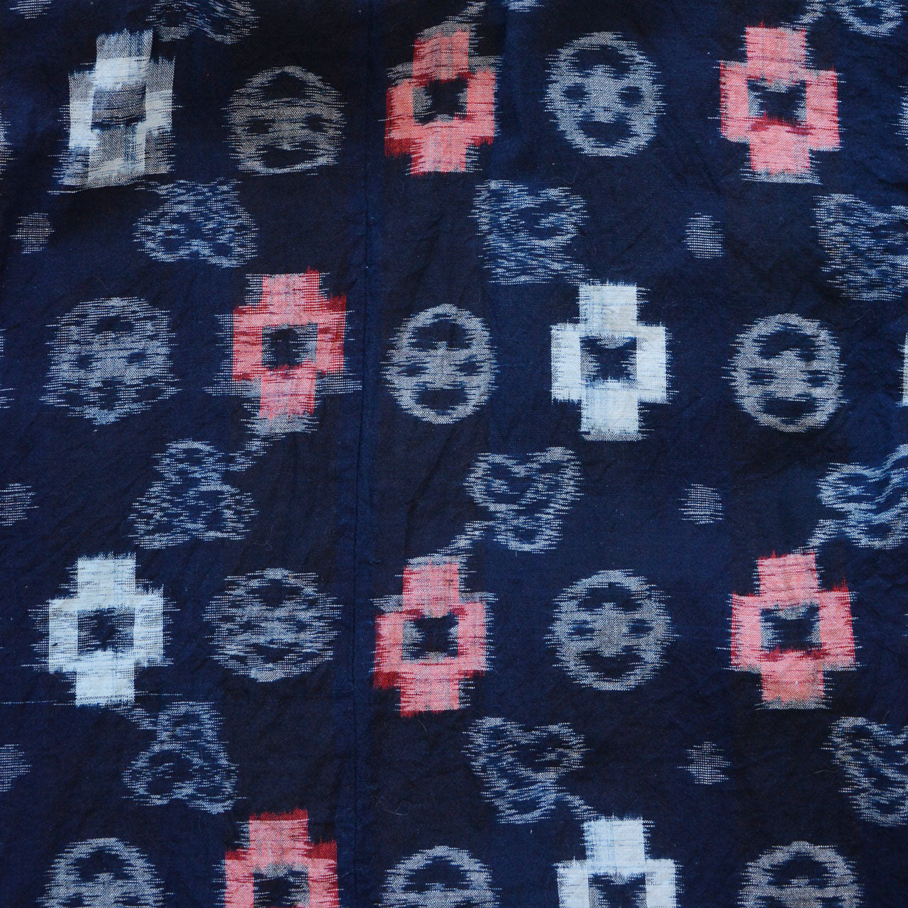 Indigo-dyed cotton noragi jacket, e-gasuri ikat weave, navy ground with multi-motif kasuri pattern in white and red, overall kasuri pattern, Japan vintage