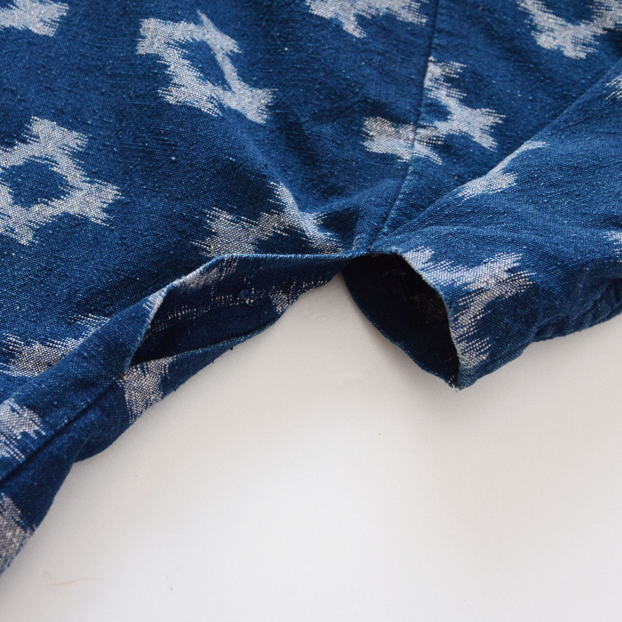 Miyatsuguchi opening detail of indigo kasuri noragi jacket, Showa-era cotton workwear