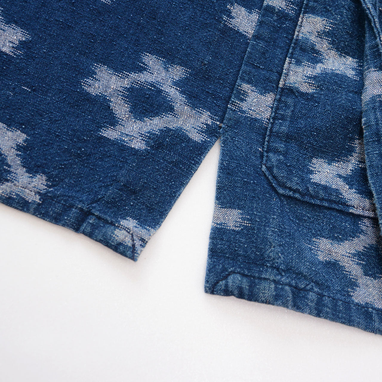 Side slit detail of indigo kasuri noragi jacket, indigo kasuri cotton, Japan vintage