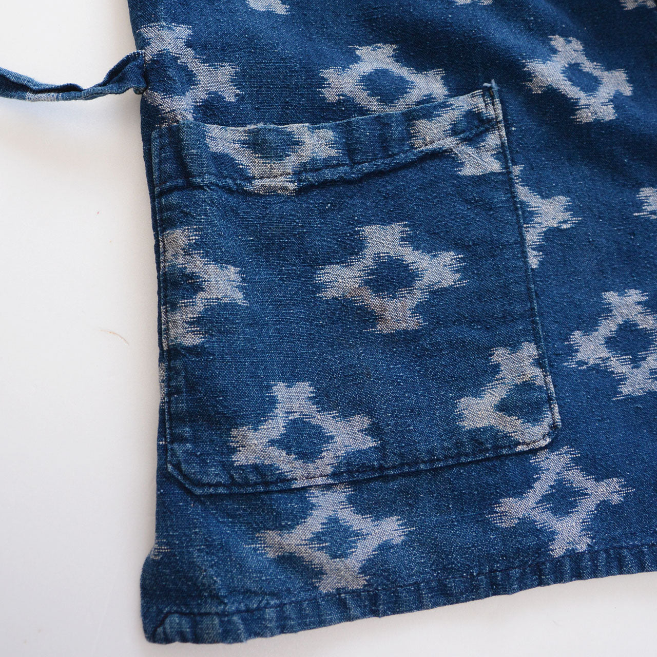 Front patch pocket detail of indigo kasuri noragi jacket, Showa-era Japan vintage workwear