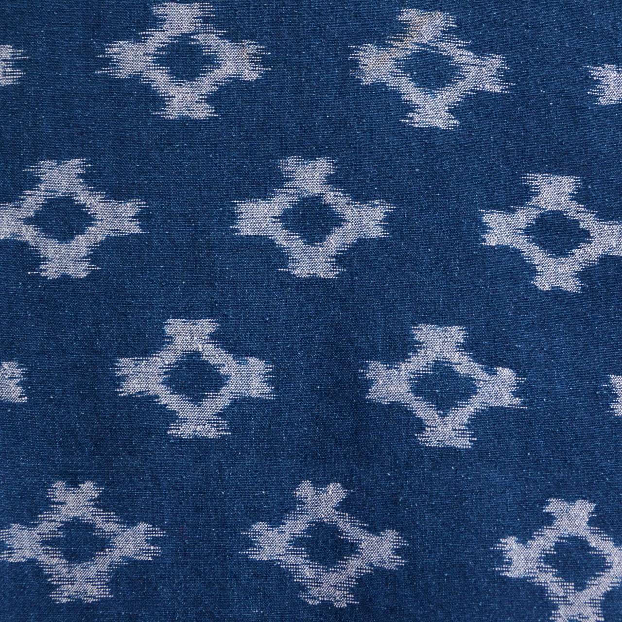 Indigo kasuri diamond ikat pattern across full fabric of Showa-era noragi jacket, Japan vintage
