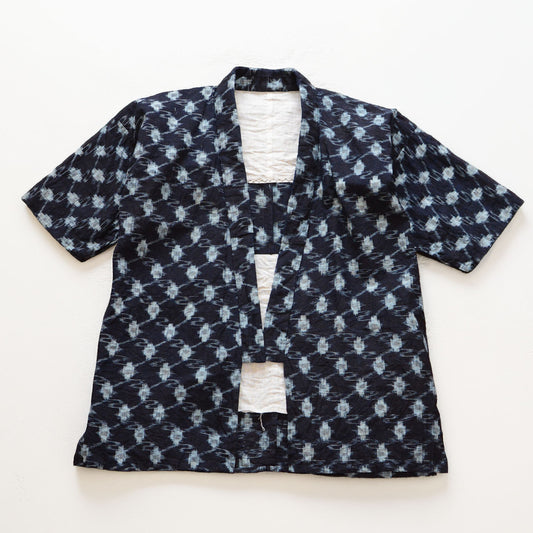 Indigo kasuri cotton noragi jacket, navy, diamond ikat pattern, open front, white cotton lining visible, Showa era Japan vintage