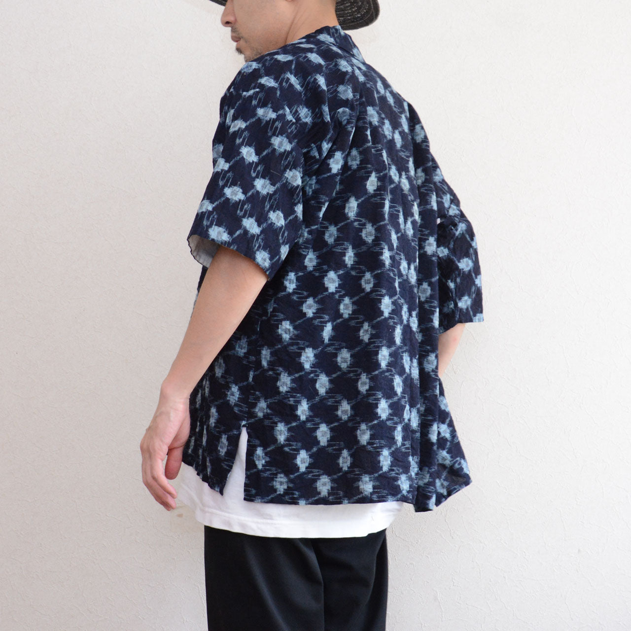 Indigo kasuri noragi jacket, back and side view, worn over white tee and black trousers, men, short sleeve, Showa era Japan vintage