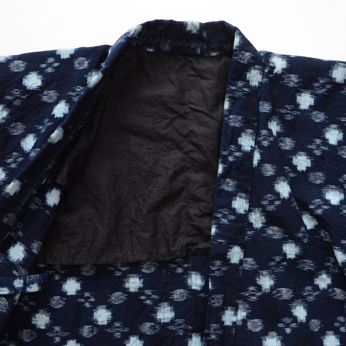 Mid-Showa indigo cotton noragi uwappari jacket with white kasuri motifs on the collar and plain black lining