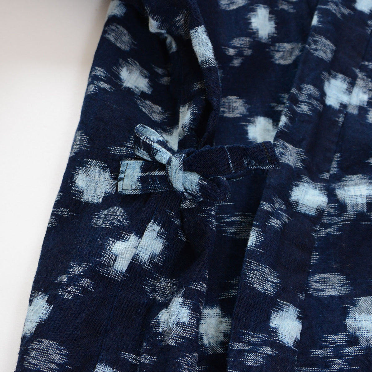 Front ties of a mid-Showa indigo cotton noragi uwappari jacket with white kasuri motifs