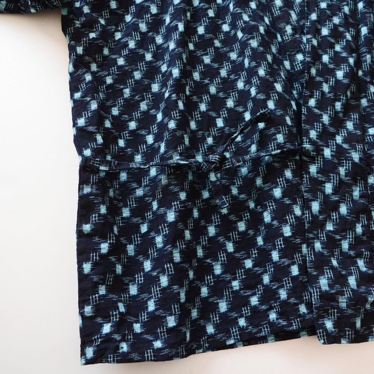 Mid-Showa era noragi field jacket in indigo kasuri cotton, hand-stitched construction