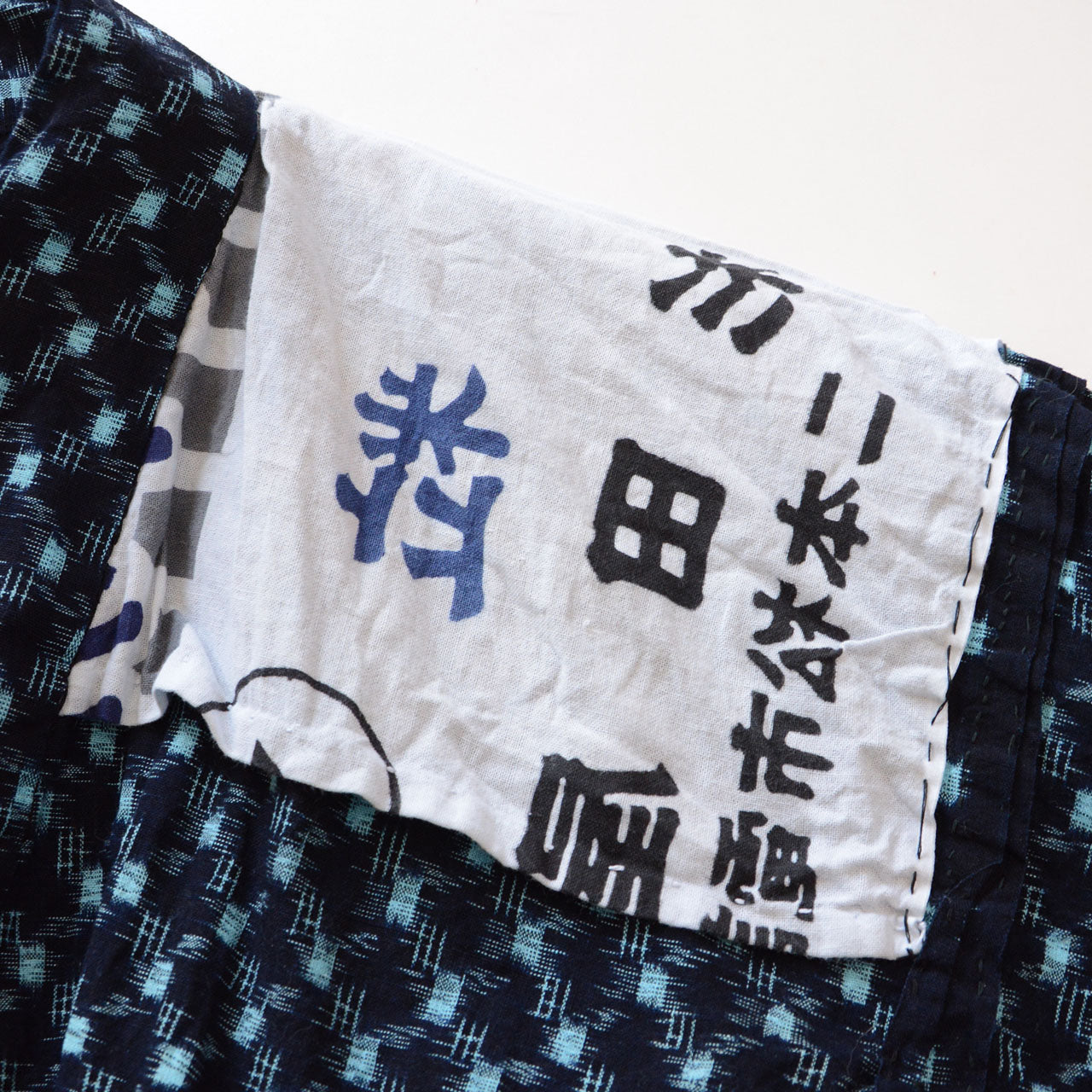 Japanese vintage noragi jacket, indigo kasuri weave, tenugui lining, circa 1940s–1960s