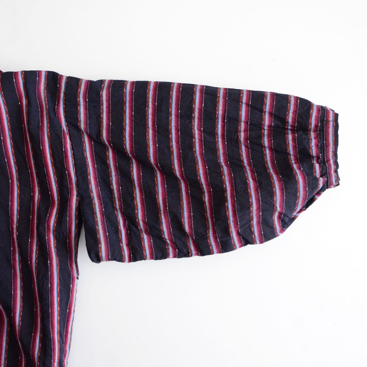 A Japanese vintage noragi textile garment in indigo tones.