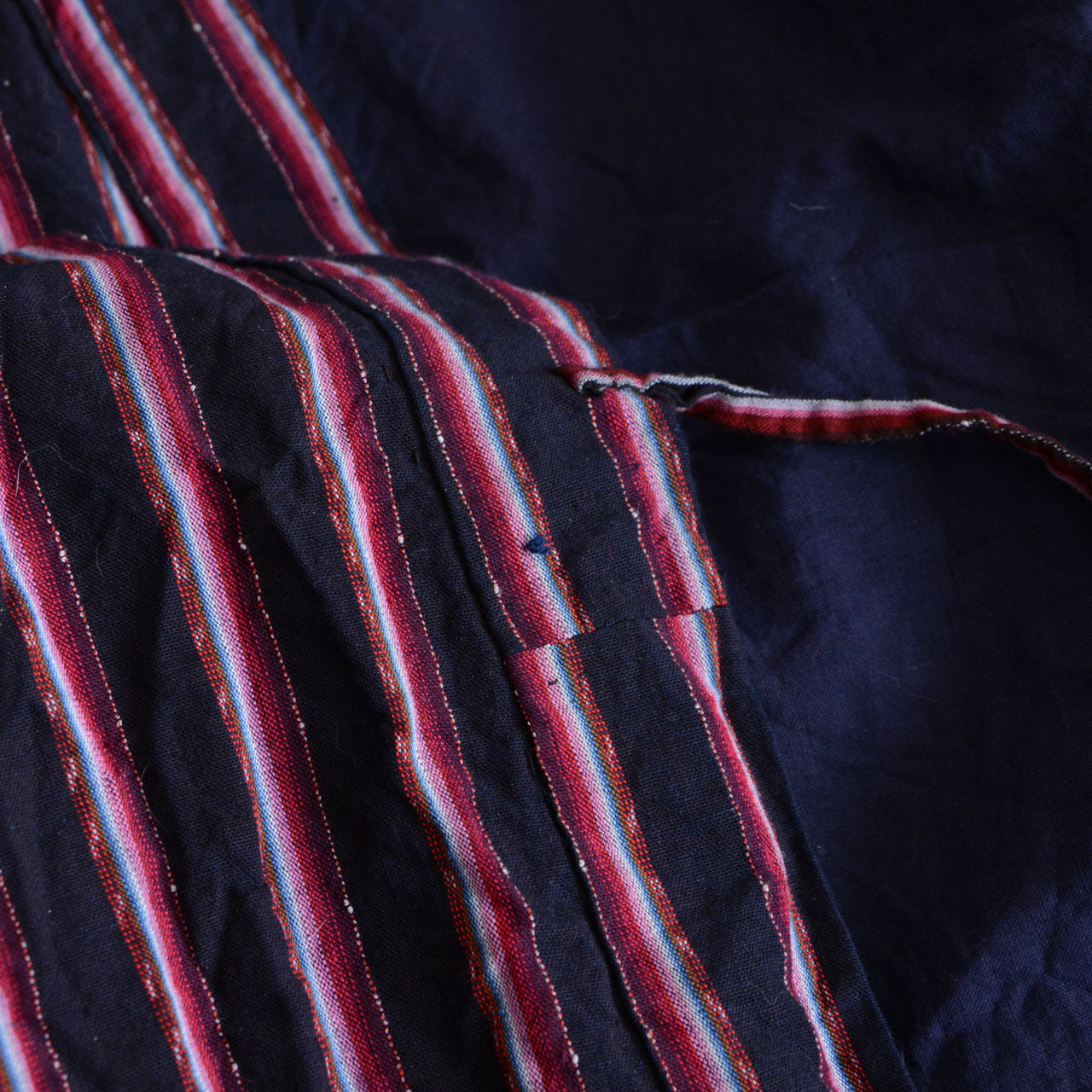 A Japanese vintage noragi garment in indigo-colored cotton.