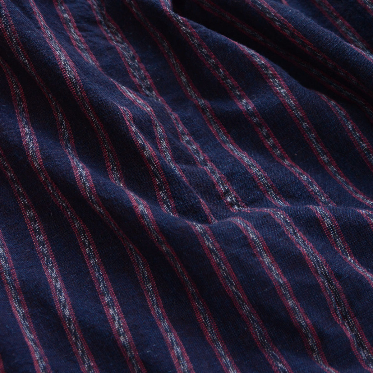 Close-up of indigo-dyed striped cotton fabric on a Japanese vintage noragi jacket