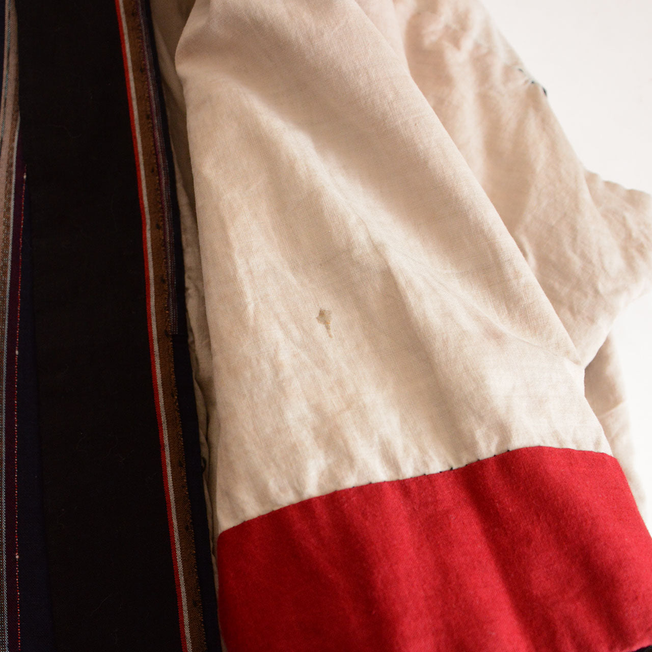 Handcrafted vintage workwear highlighting artisanal stitching.