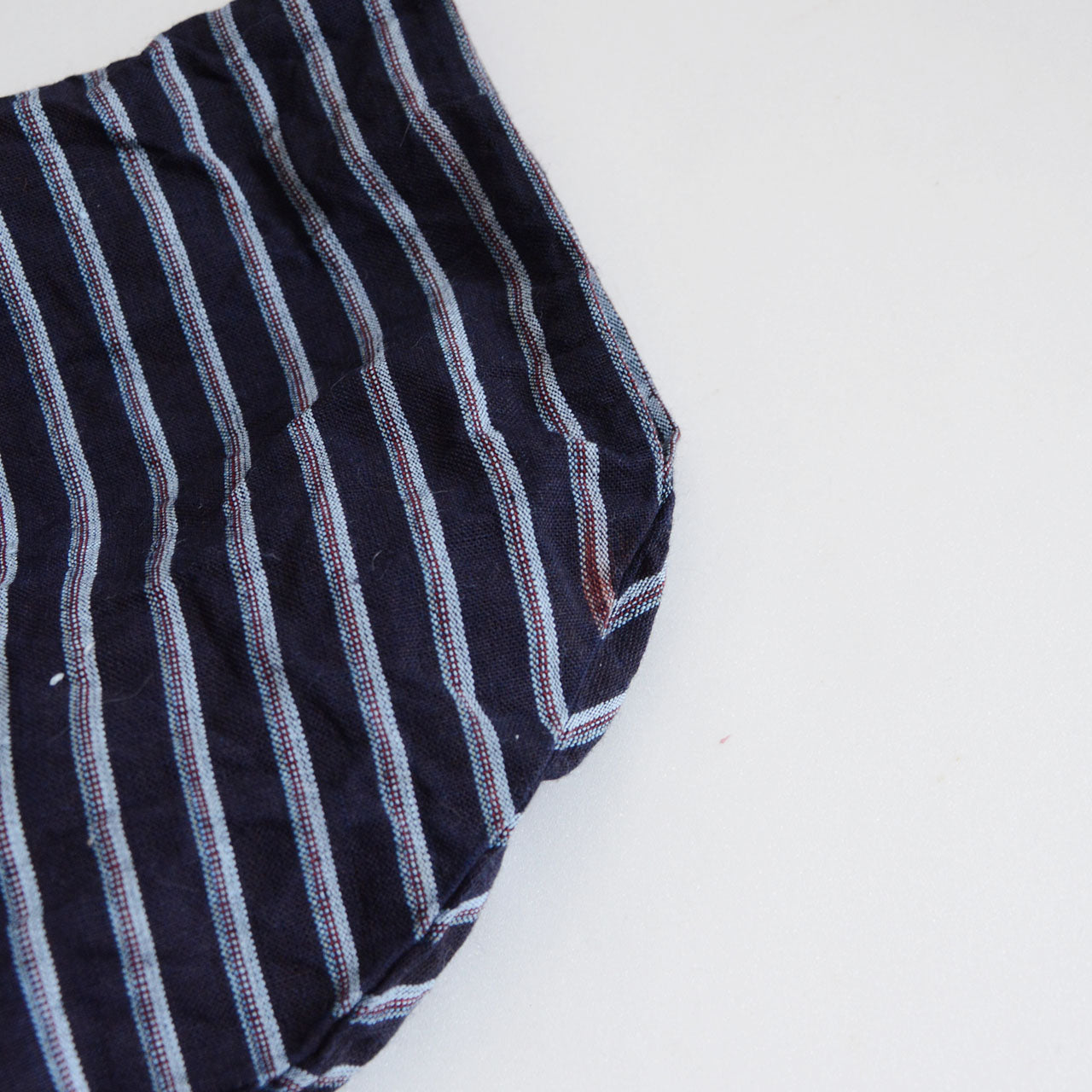 Vintage cotton garment with visible signs of age and authentic wear.