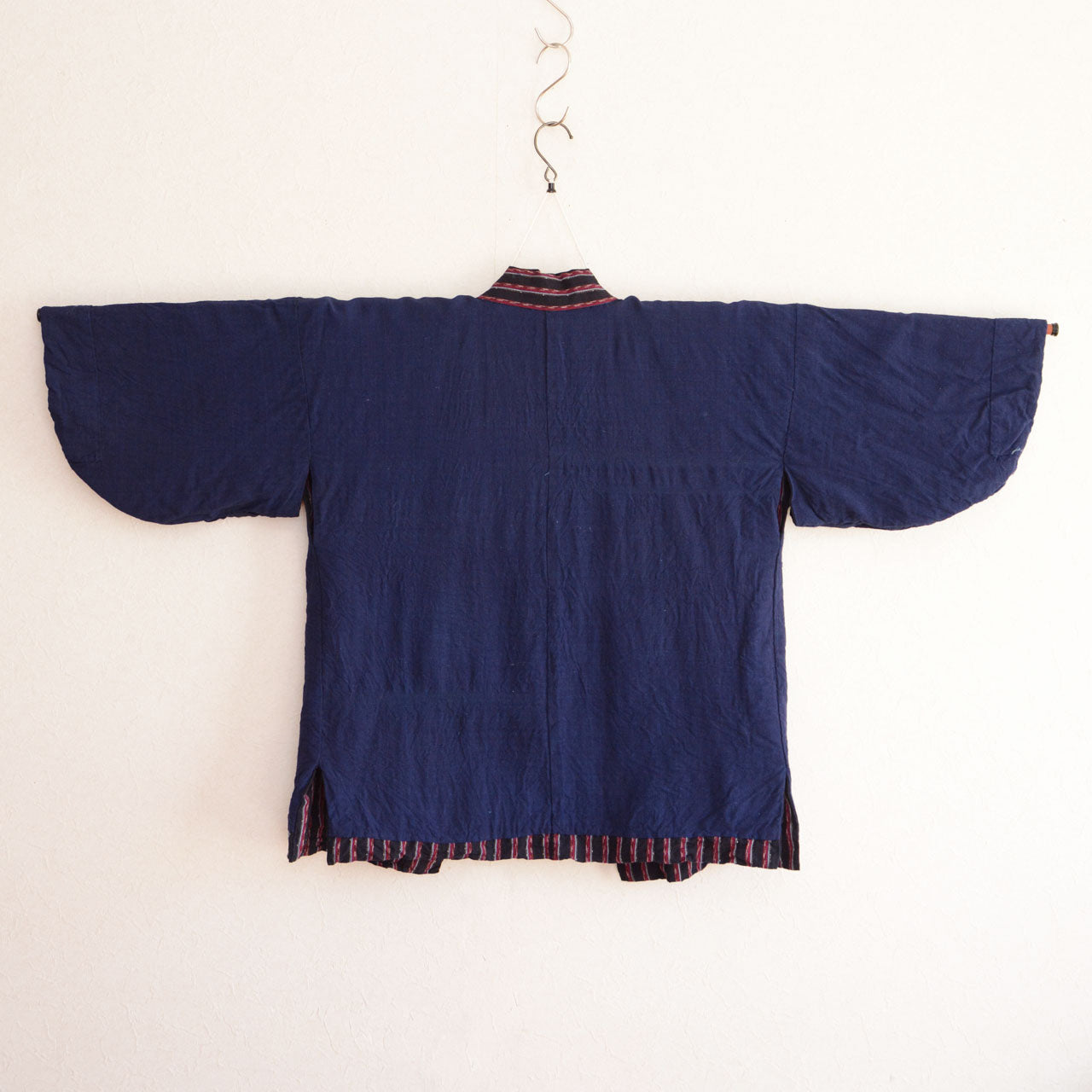 A hand-sewn Japanese noragi featuring striped outer fabric
