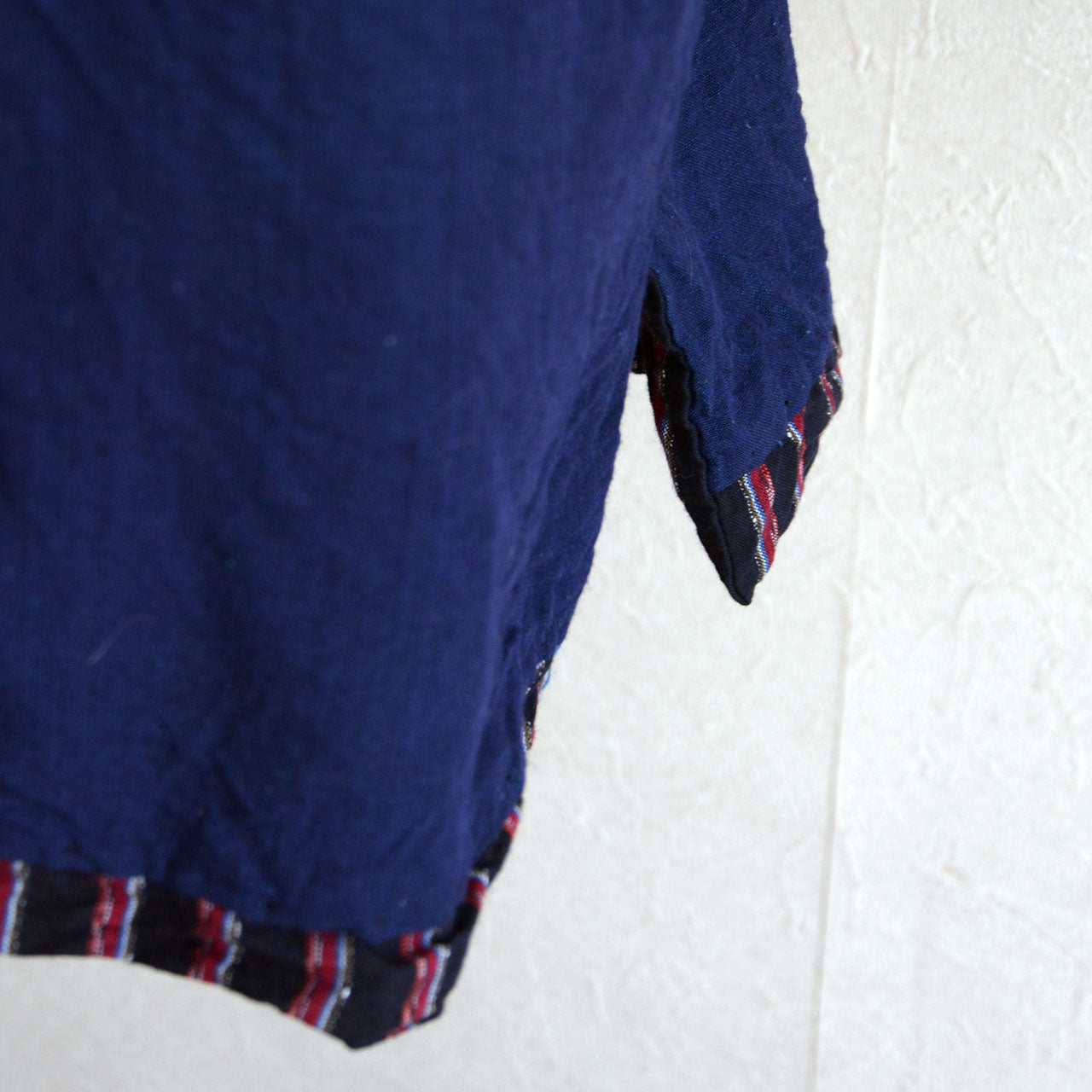 A Japanese noragi garment with striped exterior and plain interior fabric