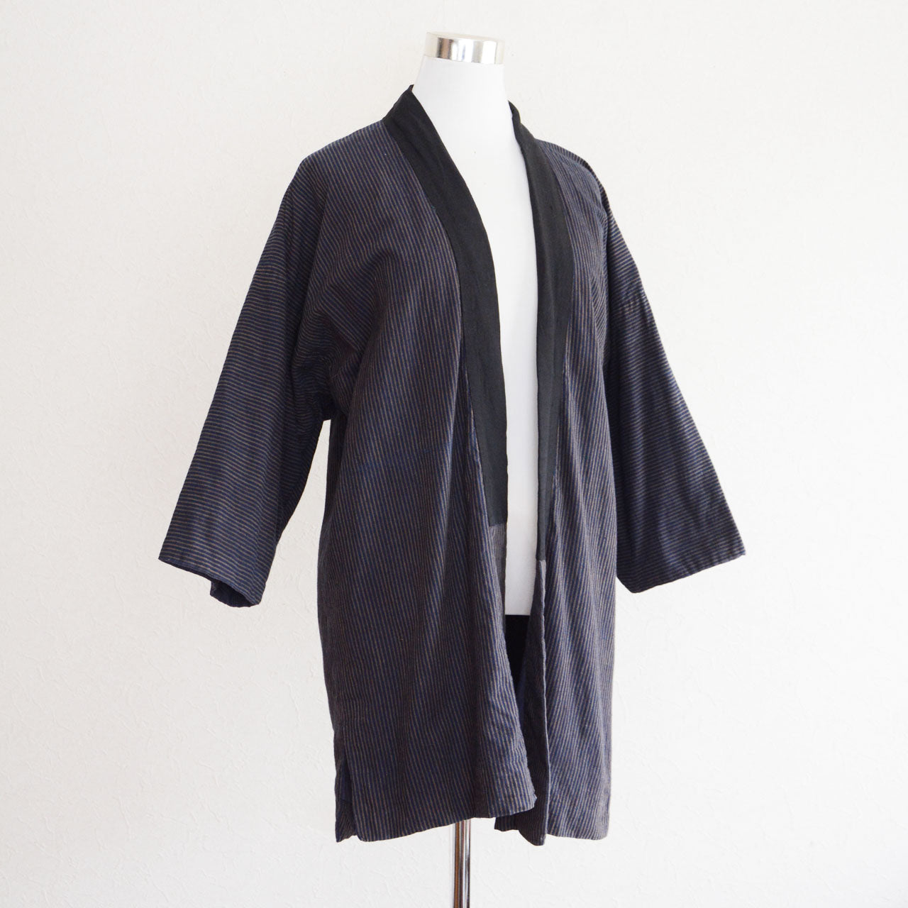 Showa mid-period Japanese noragi jacket made of indigo-dyed cotton with traditional striped pattern