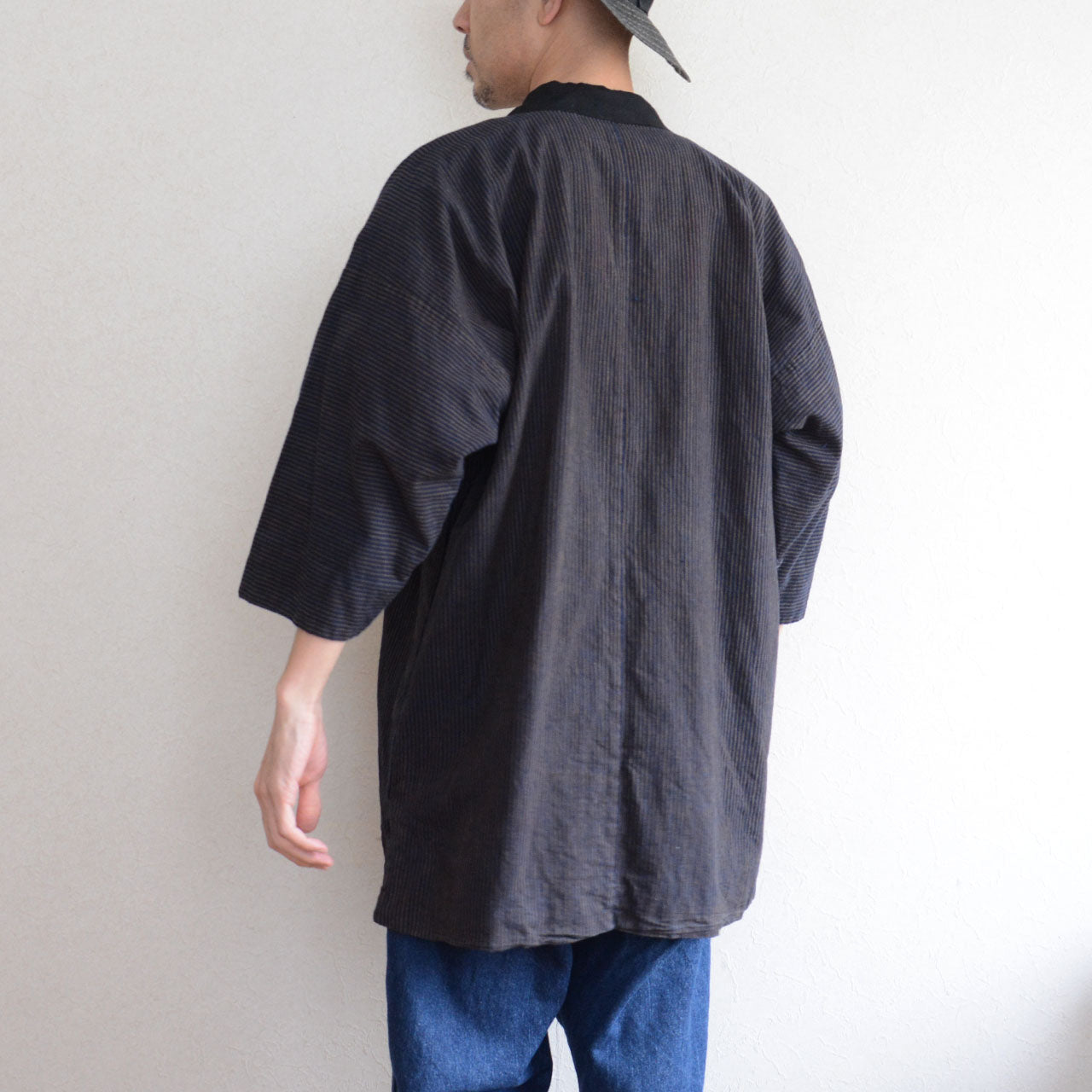 Japanese noragi jacket showcasing indigo dye craftsmanship and striped textile heritage