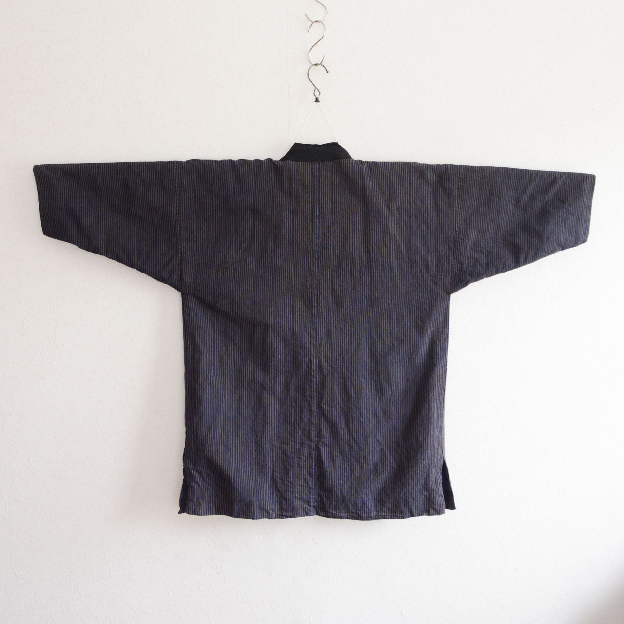 Indigo-dyed striped cotton noragi jacket representing everyday clothing of rural Japan