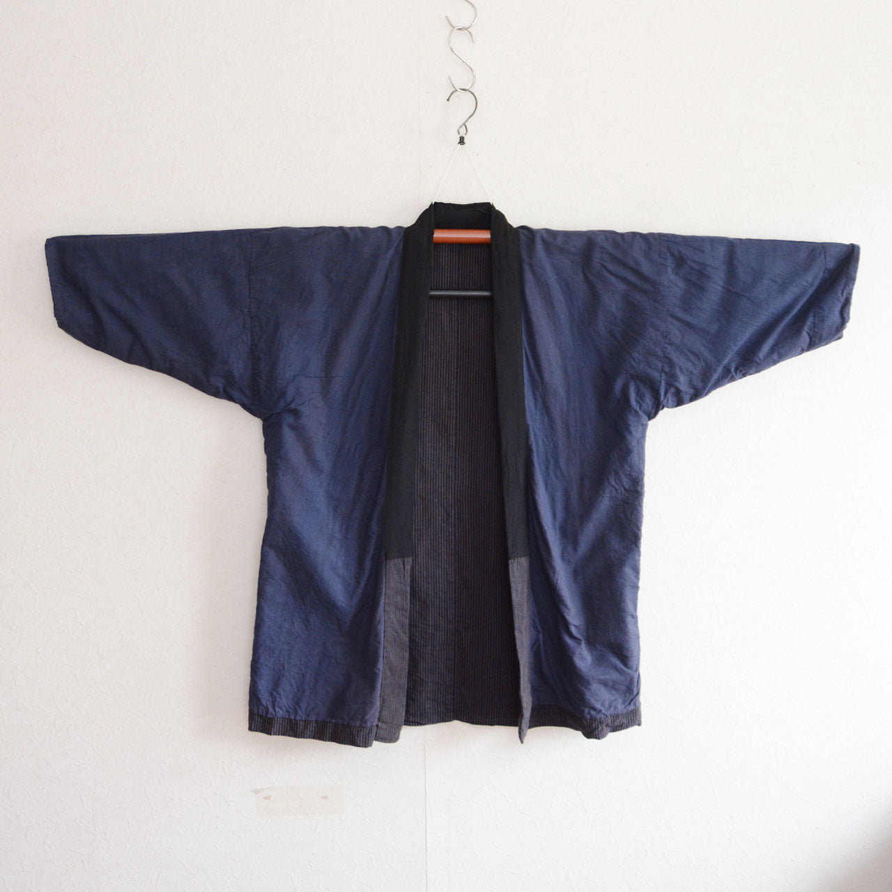 Traditional Japanese noragi jacket crafted from hand-dyed indigo striped cotton fabric