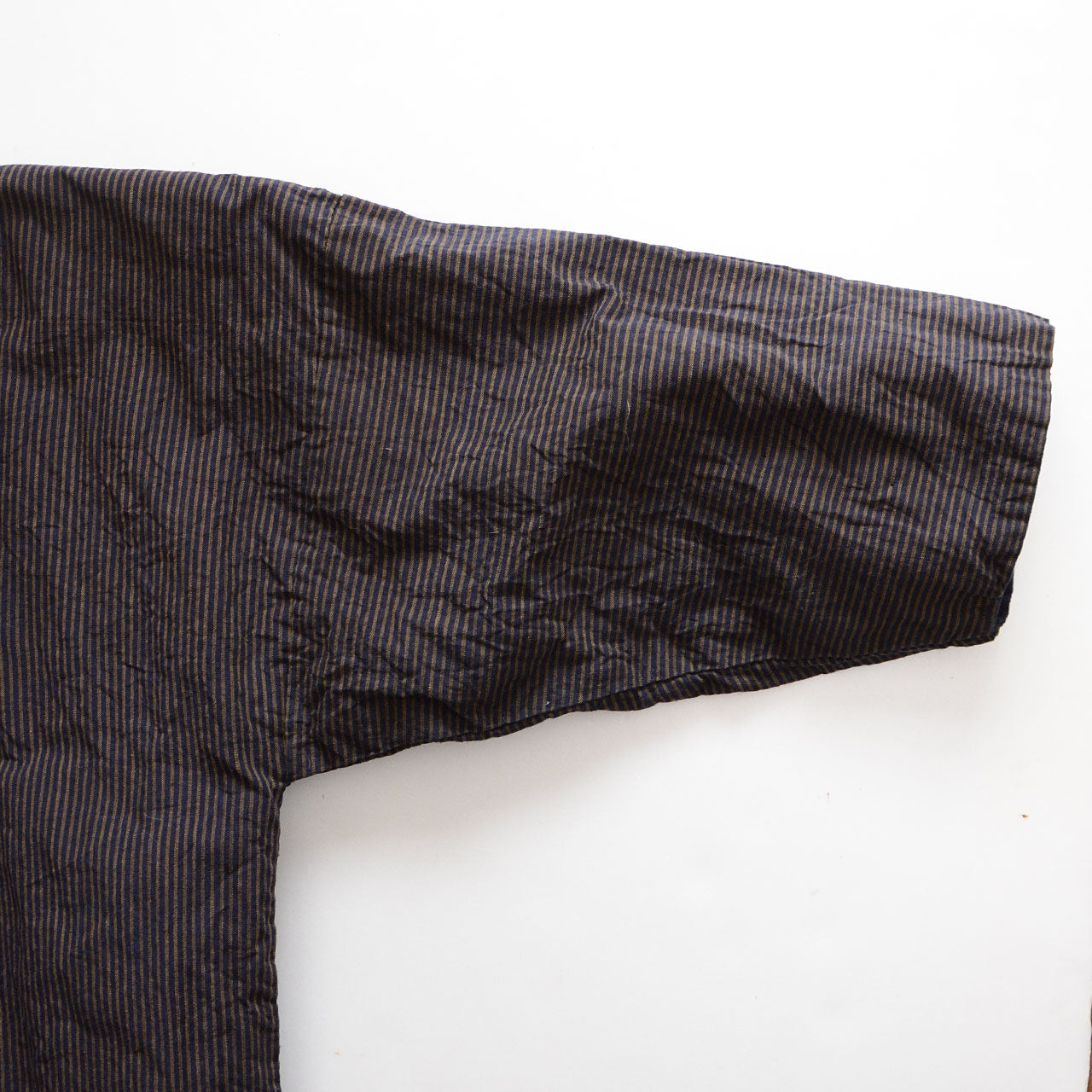 Timeless Japanese workwear garment highlighting fabric texture and hand stitching