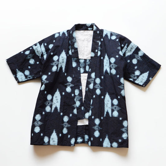 Vintage Japanese noragi jacket in indigo-dyed kasuri cotton, flat lay front view, mid-Showa era