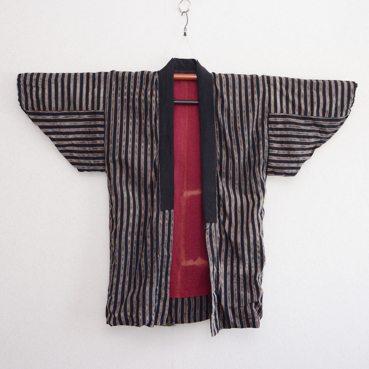 Vintage noragi jacket, outer side (gradient stripe cotton), on kimono hanger, front view — mid Showa era, Tohoku, Japan vintage