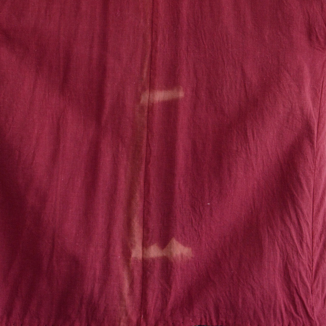 Faded crimson red cotton — inner side of vintage noragi jacket showing sun-bleached color variation, mid Showa era, Tohoku, Japan vintage