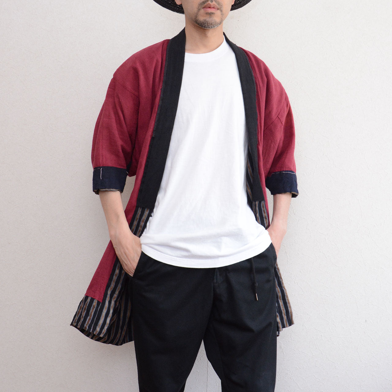 Vintage noragi jacket worn by male model, front view — gradient stripe outer, mid Showa era, Tohoku, Japan vintage