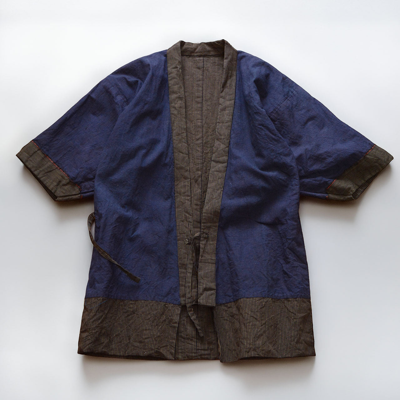 Vintage Japanese noragi jacket, solid indigo cotton lining, flat lay, front