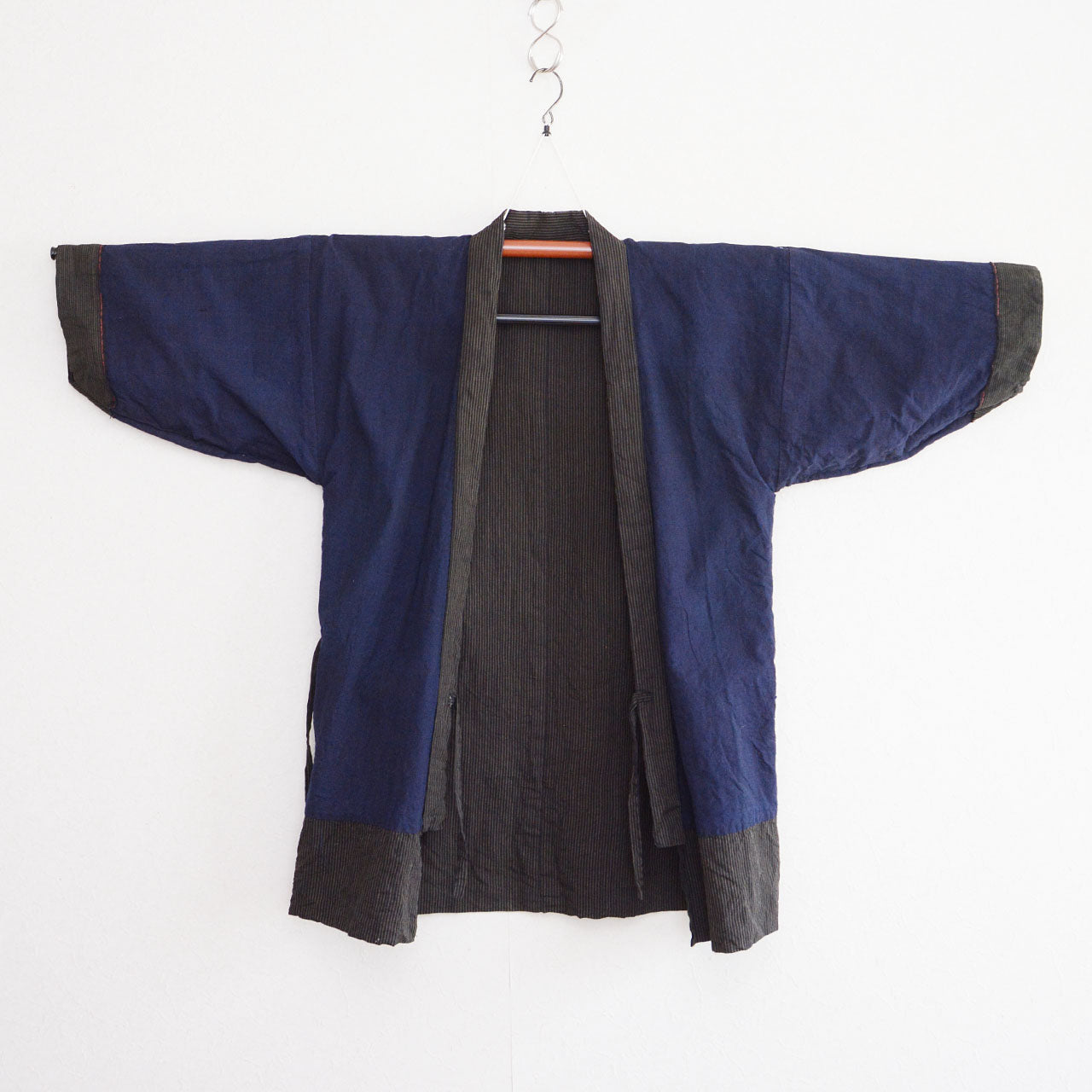 Vintage Japanese noragi jacket, solid indigo cotton lining, front, kimono hanger