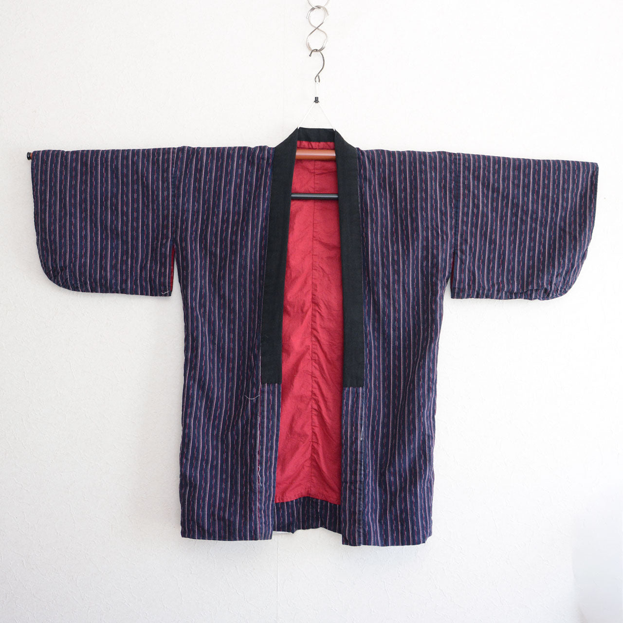 Navy cotton stripe noragi jacket on kimono hanger, front view